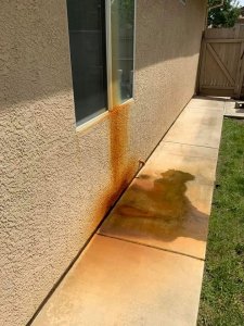 rust stains from ac drain pipe