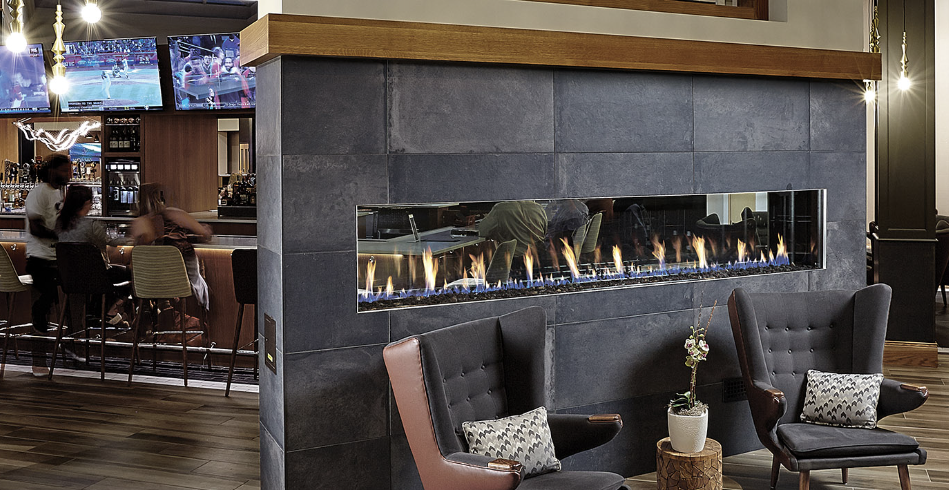 a see through commercial gas fireplace in a restaurant 